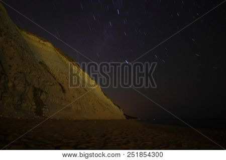 A View Of The Stars Of The Milky Way With A Mountain Top In The Foreground. Night Sky Nature Summer 