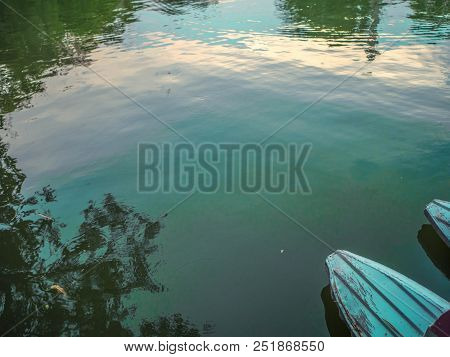 Boat On The Lake In The River,tree Reflect In The Lake,boat Head