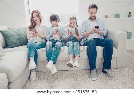 Portrait Of Family With Two Kids Having Holding Smart Phone Electronic Device In Hands Texting Sms U