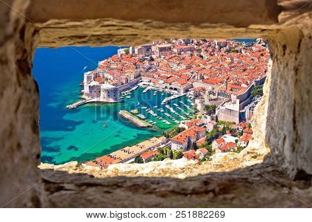 Dubrovnik Historic City And Harbor Aerial View Through Stone Window From Srd Hill, Dalmatia Region O
