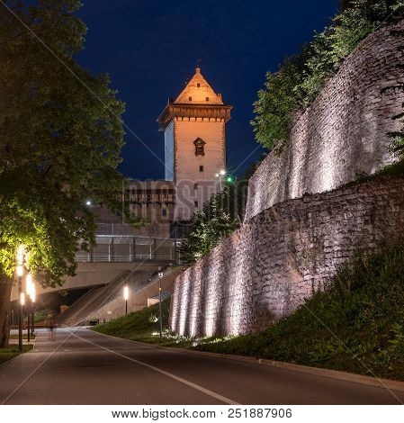 Night View Of Narva Castle With The Tower Of High Herman, Narva, Estonia. The Castle Is Illuminated.