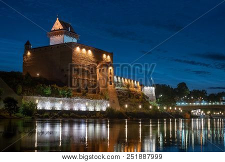 Night View Of Narva Castle With The Tower Of High Herman, Narva, Estonia. The Castle Has A Beautiful