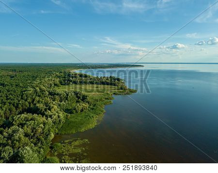 Sandy Shoreline And Sandbanks In The Water.