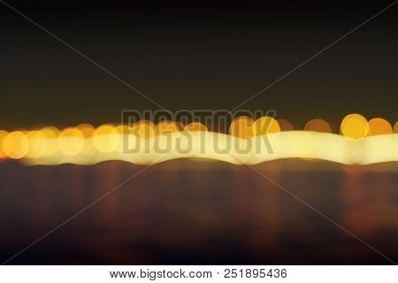 Photography Of Long-term Exposure - Night Landscape. Night City River. Moon. Is Defocused Light Dots