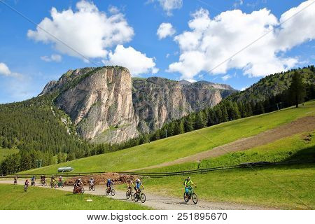Val Gardena, Italy - June 24, 2018: Mountain Bikers Climbing Above Selva Near The Dantercepies Cable