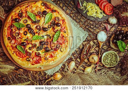 Traditional Pizza With Cheese, Tomatoes, Black Olives, Basil.