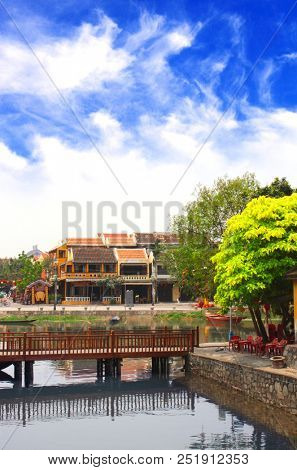 Old houses and bridge across the Thu Bon river, Hoi An, Vietnam, Indochina