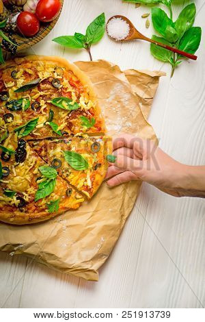 Hot Pizza With Cheese On A Rustic Wooden Board