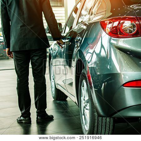 Man Business Saleman Open Door Car On Street Blurry Background.for
Automotive Automobile Or Transpor