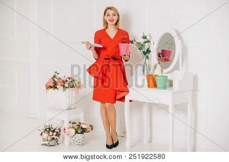 8 March Concept. Sensual Woman Plant Flower On 8 March. Woman Smile With Potted Flower On 8 March. H