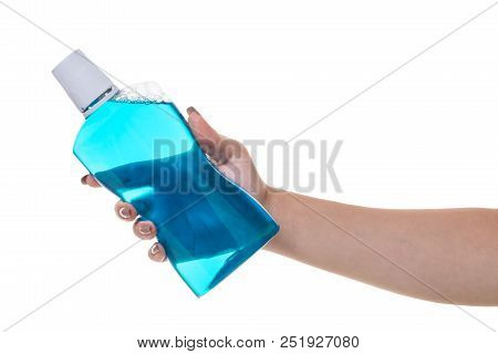 Bottle With Rinse Aid For Mouth In Hand On White Isolated Background