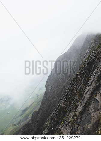 Scary Steep Mountain Scenery Covered In Fog In The Swiss Alps Brienzer Rothorn Switzerland