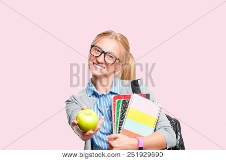 Happy Young Student Girl Holding Books, High School Or College Graduand On Pink Background. Back To 