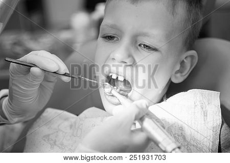 A Little Boy At A Dentist's Reception In A Dental Clinic. Children's Dentistry, Pediatric Dentistry.