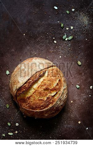 Fresh Homemade Bread From Whole Wheat And Rye Flour With Flax Seeds, Pumpkin And Oat Flakes On A Bro