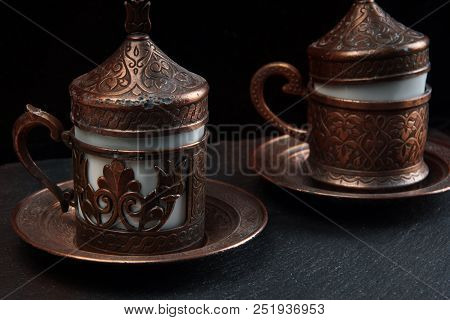 Two Pieces Of Turkish Lakuma Lie On The Table, Next To The Coffee.