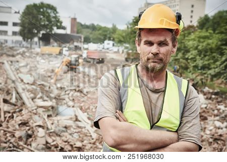 Demolition construction work. Worker at building site