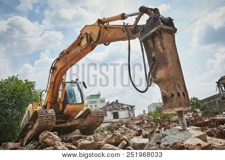 secondary demolition by excavator with hydraulic hydrohammer breaker