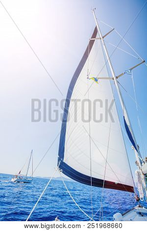 White Sails Of A Sailing Yacht In The Wind