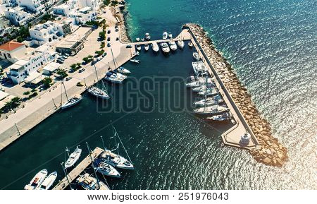 airview of small yachts moored at berth in port at sunny summer day