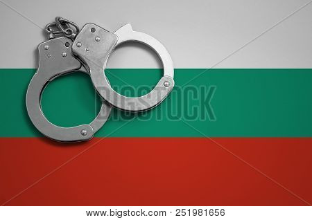 Bulgaria Flag  And Police Handcuffs. The Concept Of Crime And Offenses In The Country
