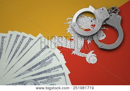 Bhutan Flag  With Handcuffs And A Bundle Of Dollars. The Concept Of Illegal Banking Operations In Us