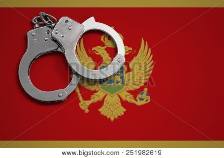 Montenegro Flag  And Police Handcuffs. The Concept Of Crime And Offenses In The Country
