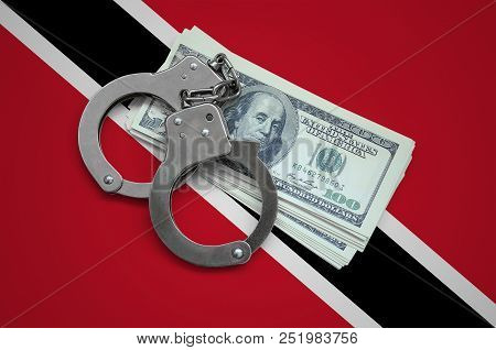 Trinidad And Tobago Flag  With Handcuffs And A Bundle Of Dollars. Currency Corruption In The Country