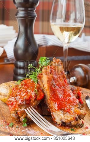 Bbq Pork Ribs With Potatoes And Kou Slow Salad On A Wooden Board
