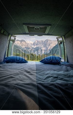 View From Bed In Camper Van To Forest In Zgornje Jezersko And Kamnik-savinja Alps On A Cloudy Summer