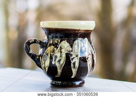 Cup Made Of Clay. Handma- Artisanal Mug. It Is Used In Rural Areas Of Romania To Drink Water Or Wine