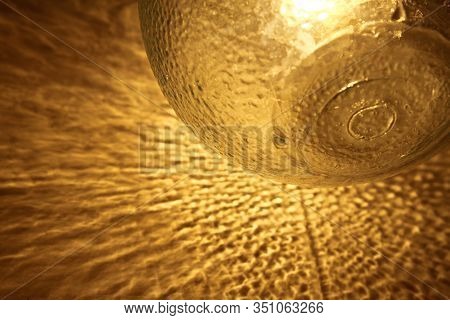 Abstract Patch Of Reflected Light Of A Glass Lamp On The Wall, Shadow And Light Background