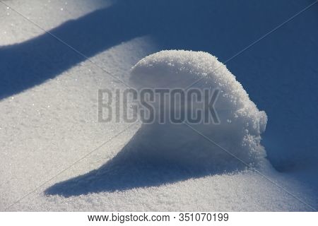 Snow-covered Stump. Winter Snow At The End Of February.