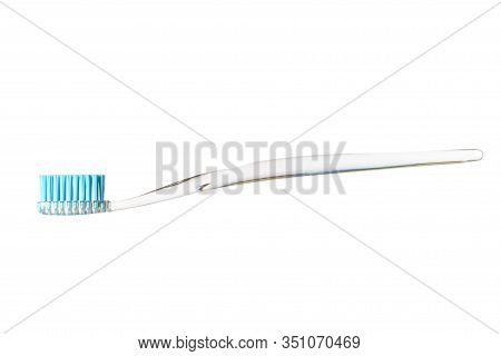 Toothbrush And Toothpaste On Blurred Background. Care For The Oral Cavity And Teet