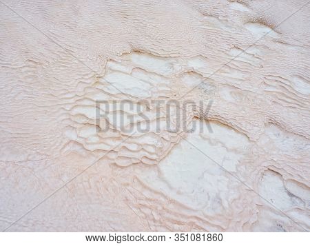 Undulatory Texture Of White Calcite Stalactites Covering A Cascade Of Terraced Baths In Pamukkale, T