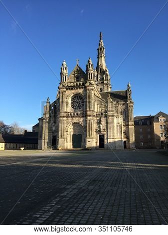 A Beautiful French Church Against A Deep Blue Sky