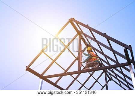 Roof Technician Roofing Makers Work With The Roof Structure Of A Building On A Construction Site. Ro