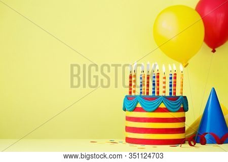 Colorful birthday party background with birthday cake and balloons