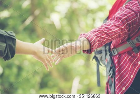 Young Traveler With A Green Nature Relaxation In The Park. Friendship Try To Solve Solution Through 