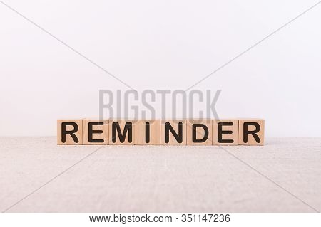 Reminder Word Made Of Building Blocks On A White Background