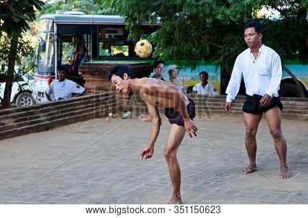 Bagan, Myanmar - Nov 15, 2019: Burmese Men Playing The Traditional Ball Game Of Myanmar: Chinlone.