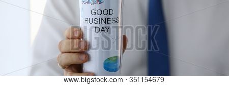 Man Hold In Hand Thermal Flask With Hot Beverage Closeup. Good Business Day With Coffee Drink Concep