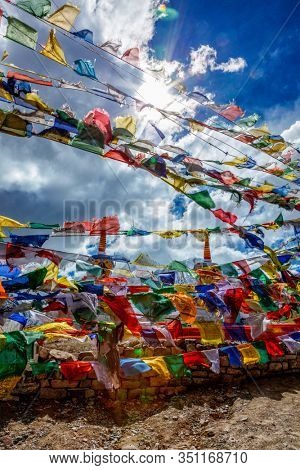 Prayer flags with Buddhist mantra on them at high Kunzum La pass, Himachal Pradesh, India