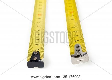 Flexible Metal Rulers With Metric Scales Of Two Self-retracting Tape Measures Close-up In Selective 