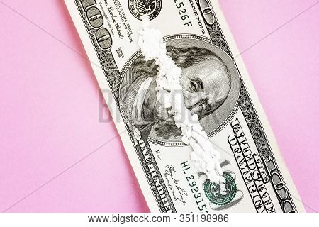 White Powder In The Form Drugs On The Ben Franklin's Mouth Under The Nose Of Hundred-dollar Bill. Co