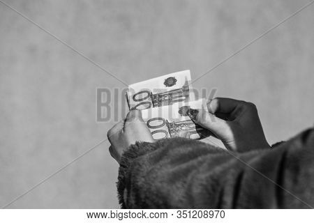 Hand Couting Holding And Showing Euro Money Or Giving Money. World Money Concept, 100 Euro Banknotes