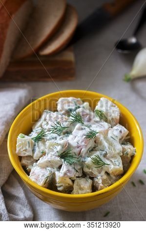 Traditional Cold Potato Salad With Onions And Herbs On A Linen Tablecloth Background. Rustic Style.