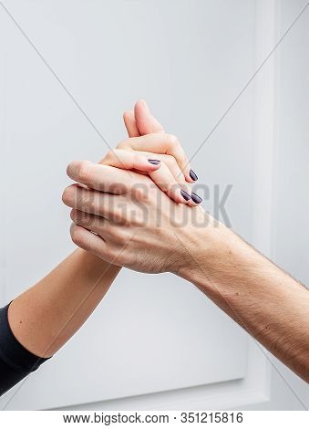Close Up Of Delicate Tender Hands Of Dancers. Ballroom Dancers On The Dance Floor.