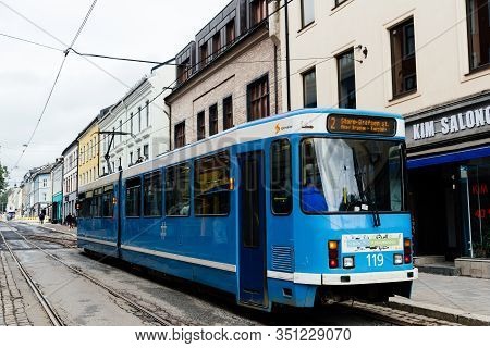 Oslo, Norway - August 11, 2019: Blue Tram Speeding Up In Grunerlokka, A Trendy Hipster Neighborhood 