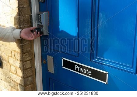 Private Room With Secure Code, Keyless Entry Lock Or Keypad Push Technology Door Lock. Human Hand Tr